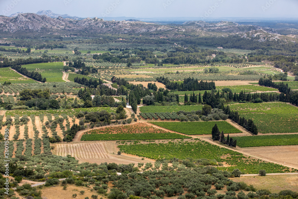 Panoramic view on Luberon valley from the famous Les Baux de Provence medieval village in Southern France Panoramic view on Luberon valley from the famous Les Baux de Provence medieval village in Southern France