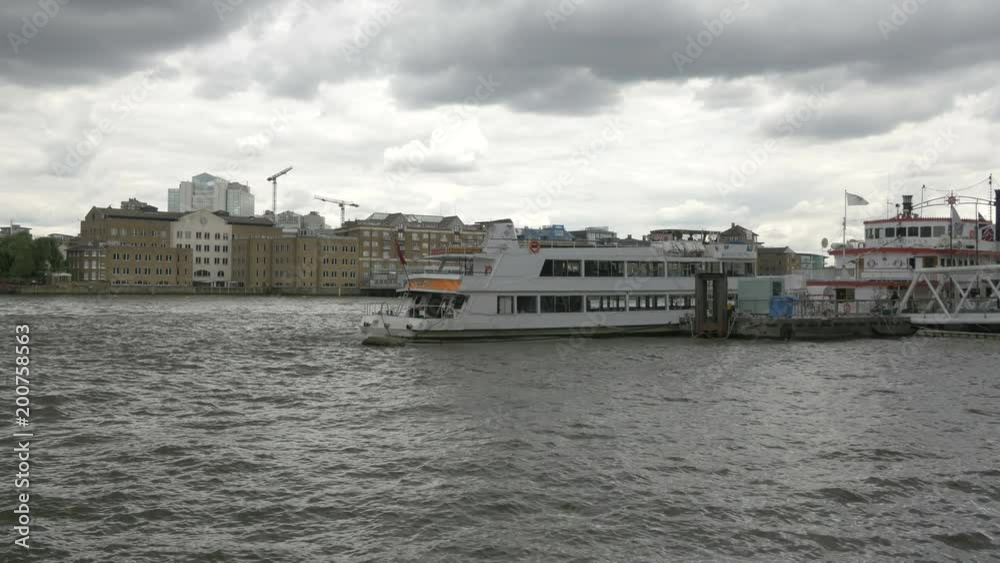 Sightseeing boats anchored in River Thames Sightseeing boats anchored in River Thames