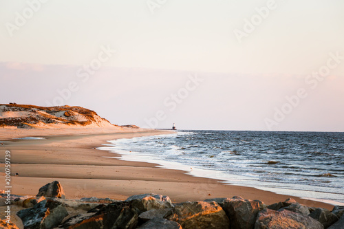 coastal sunrise dunes lighthouse photo