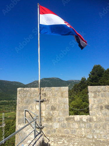 the croatian flag at an old tower photo