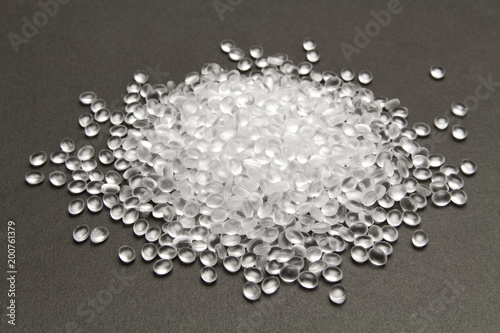Transparent Polyethylene granules on dark .HDPE Plastic pellets.  Plastic Raw material . IDPE. photo