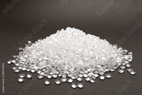Transparent Polyethylene granules on dark .HDPE Plastic pellets.  Plastic Raw material . IDPE. photo
