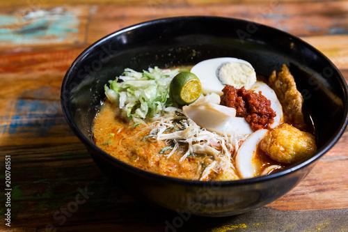 Serving of Nyonya Laksa, popular spicy noodle soup in Malaysia