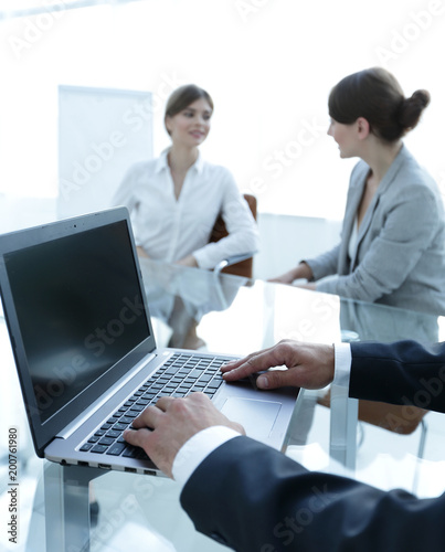 closeup of male hands typing on a laptop. © ASDF