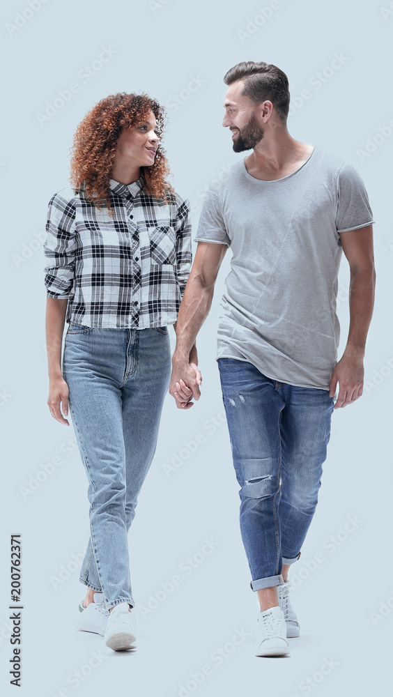 young people holding hands and walking forward. young people holding hands and walking forward.