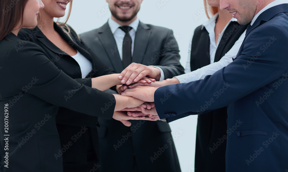 friendly business team with hands clasped together. friendly business team with hands clasped together.