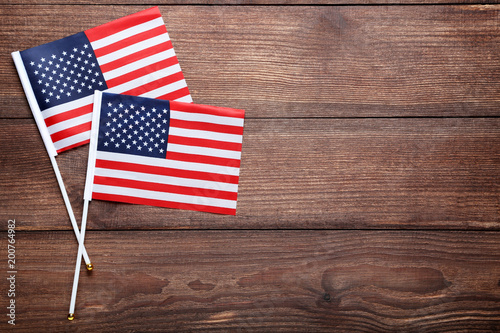 American flags on brown wooden table