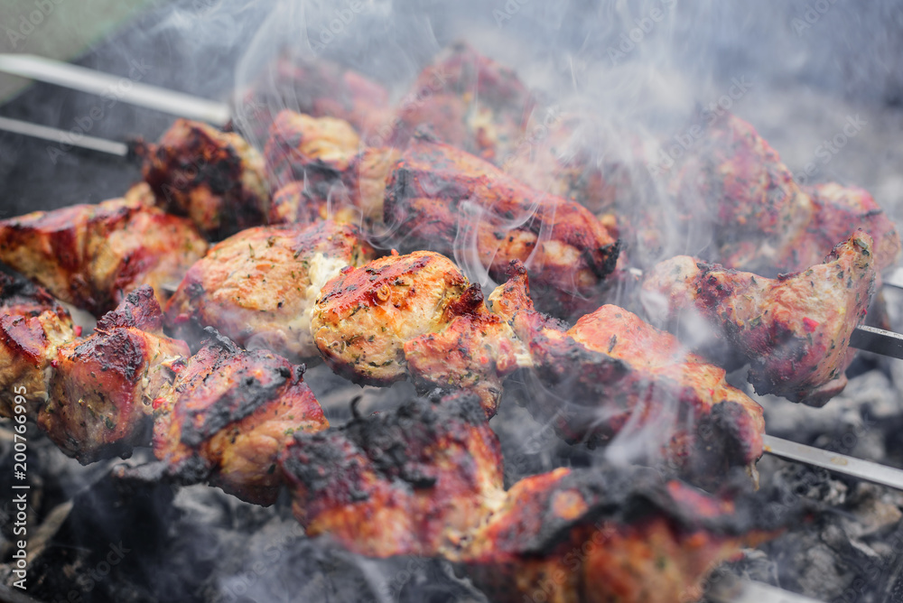 Barbecue or shish kebab is fried on the grill. Barbecue or shish kebab is fried on the grill.