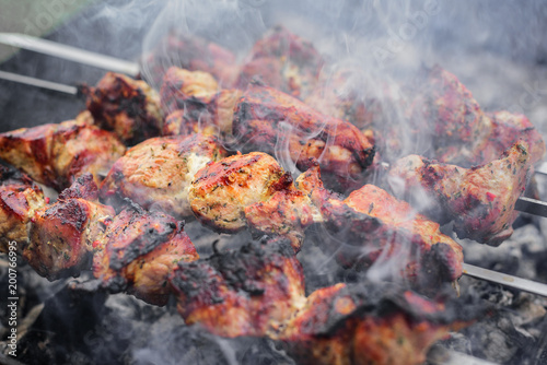 Barbecue or shish kebab is fried on the grill.