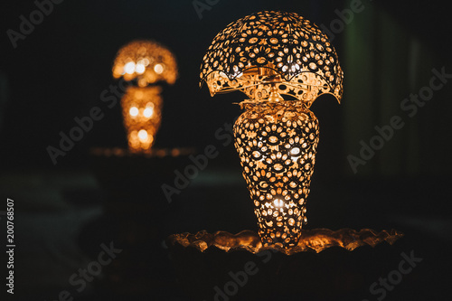  shiny background of illuminated beautiful lighting lamps, closeup view photo