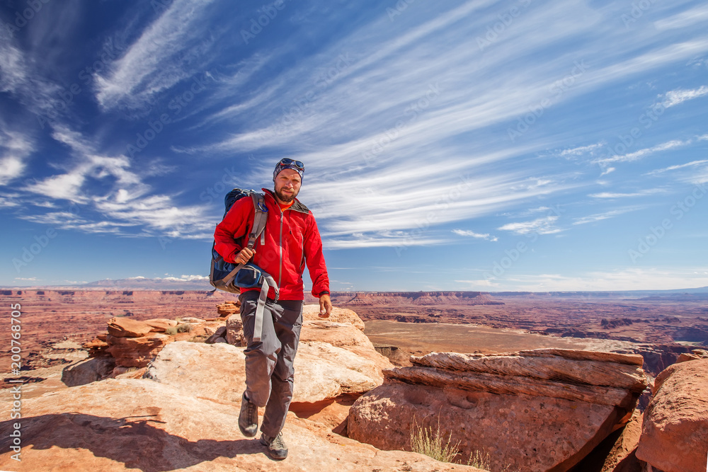 Hiker in Canyonlands National park in Utah, USA Hiker in Canyonlands National park in Utah, USA