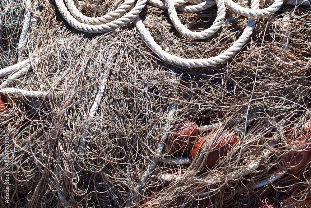 Ship tackle. Nautical background. Old fishnet and rope. Ship tackle. Nautical background. Old fishnet and rope.