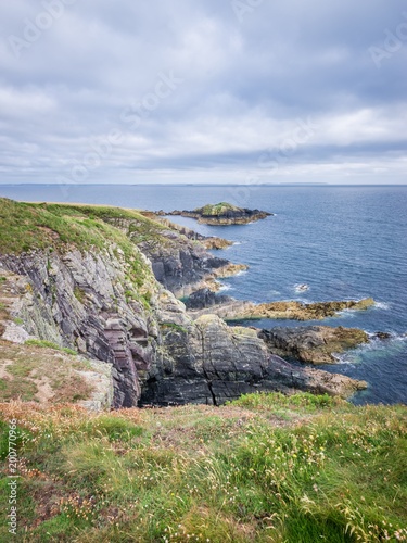 Caerfai Beach footpath area seascape view on a cloudy day West Wales UK. photo