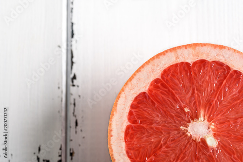 Grapefruit on white wooden background photo