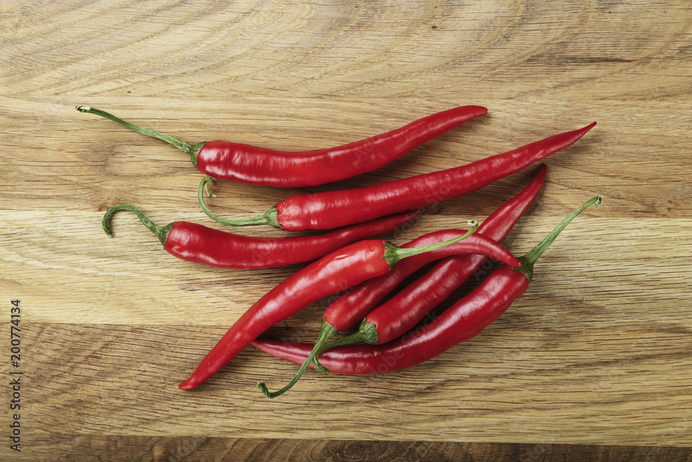 red hot pepper on a wooden background