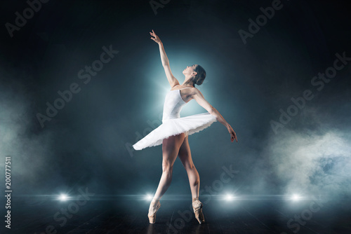 Fotobehang Ballet dancer dancing on the stage in theatre