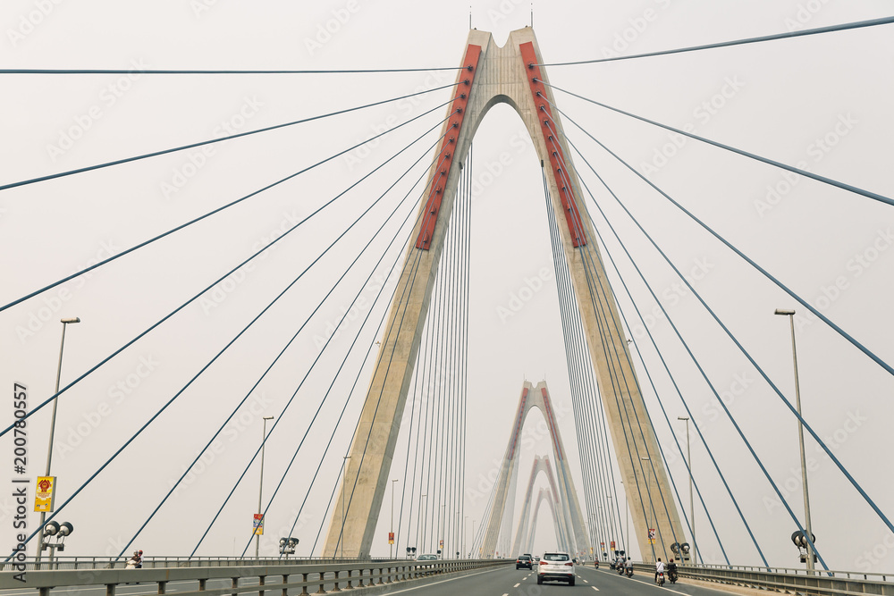 Nhat Tan suspension bridge that view from moving car from below in Hanoi, Vietnam. Nhat Tan suspension bridge that view from moving car from below in Hanoi, Vietnam.