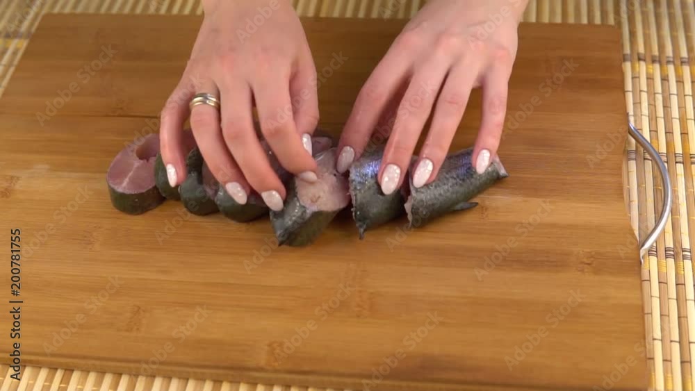 Pieces of trout on a wooden board. Cooking food on a wooden board Pieces of trout on a wooden board. Cooking food on a wooden board