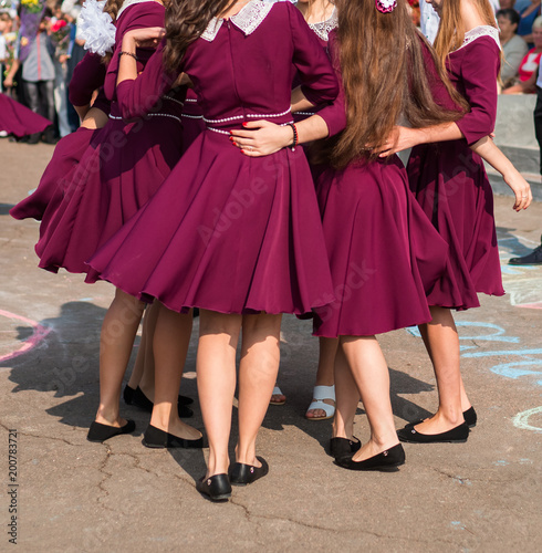 elegant graduates are dancing waltz photo