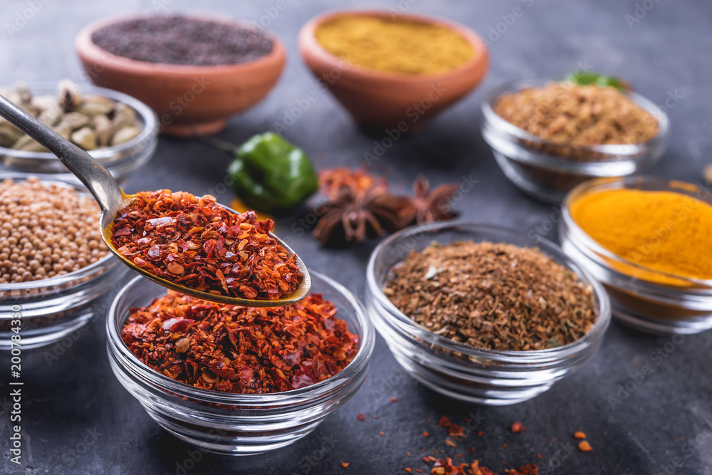 Set of colorful spices   on a dark  background.
