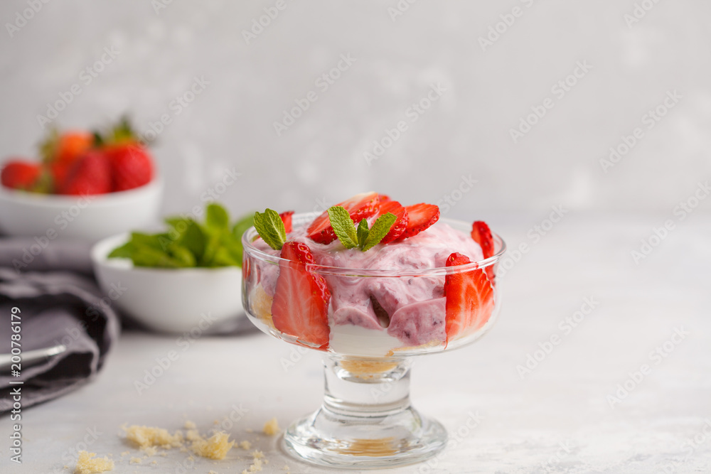 Strawberry dessert. English berry trifle, cheesecake, parfait. Berry mousse in glass on a light background. Strawberry dessert. English berry trifle, cheesecake, parfait. Berry mousse in glass on a light background.