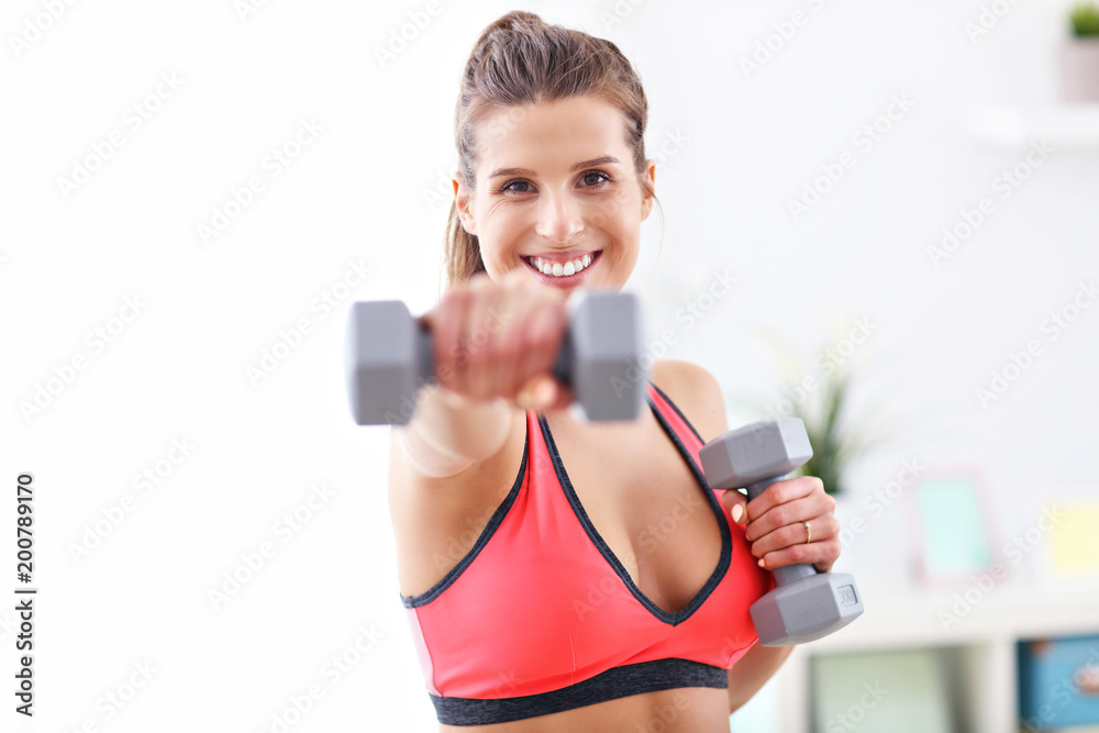 Woman doing fitness exercises at home Woman doing fitness exercises at home