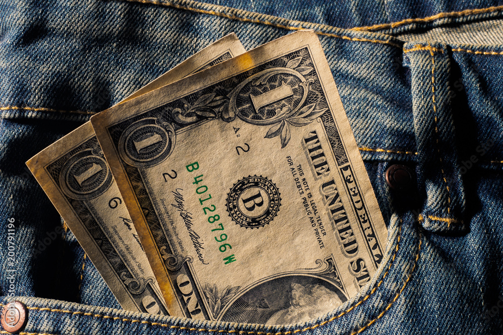 Amarican money Dollar in blue jeans pocket denim background texture. Stock  Photo | Adobe Stock