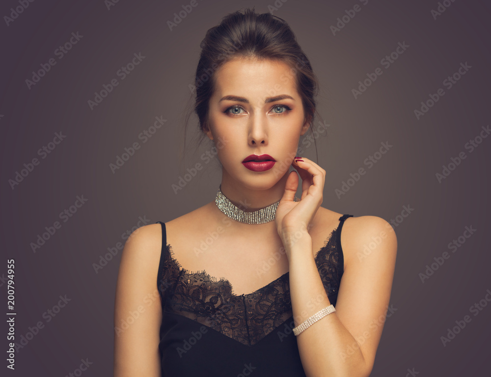 Beautiful model girl with elegant hairstyle . Woman with red lips and nails . Cosmetics, beauty and manicure on nails. Beautiful model girl with elegant hairstyle . Woman with red lips and nails . Cosmetics, beauty and manicure on nails.