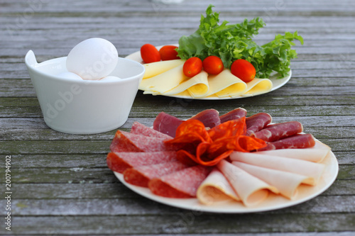 Breakfast with cold cuts and eggs photo