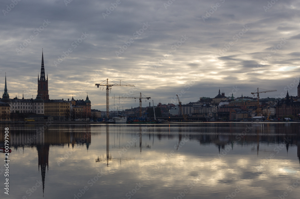 The reflection of city of Stockholm, construction, cranes and old buildings