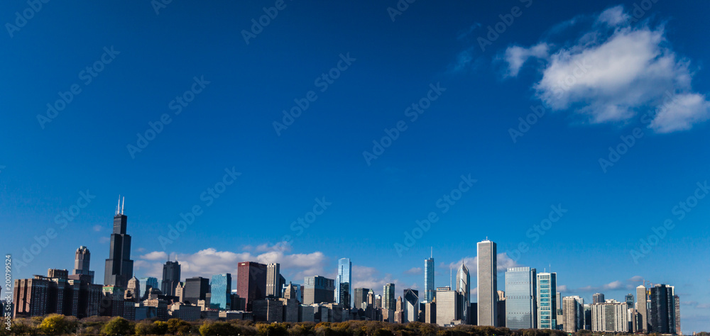 Wide Angle shot of Chicago Skyline with various skyscrapers with a blue sky on a sunny day