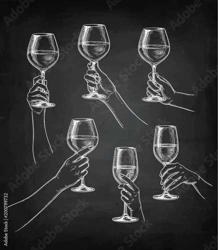 Set of hands with wine glasses