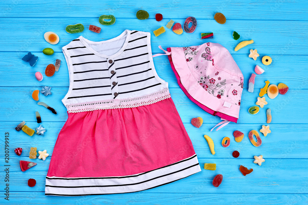 Toddler girl summer fashion background. Little girls cotton modern clothes. Baby-girl fashion style. Toddler girl summer fashion background. Little girls cotton modern clothes. Baby-girl fashion style.