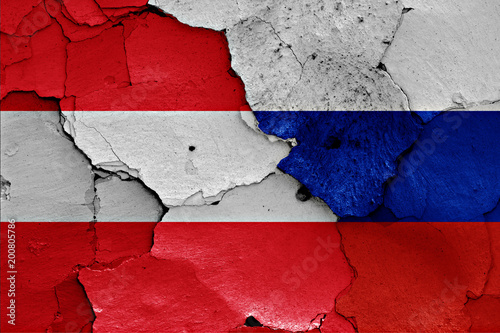 flags of Austria and Russia painted on cracked wall