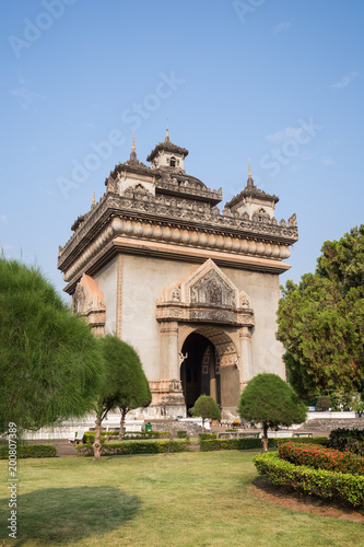 View of the Patuxai (Victory Gate or Gate of Triumph) war monument in Vientiane, Laos, on a sunny day.