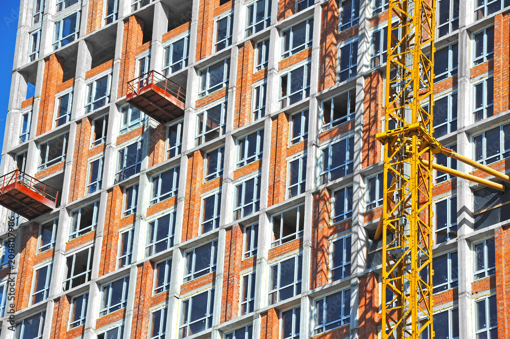 Obraz premium Crane and highrise construction site