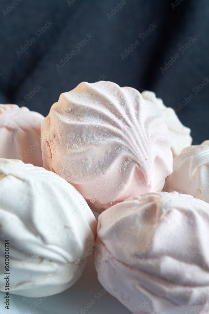 White zephyr marshmallow on porcelain plate White zephyr marshmallow on porcelain plate