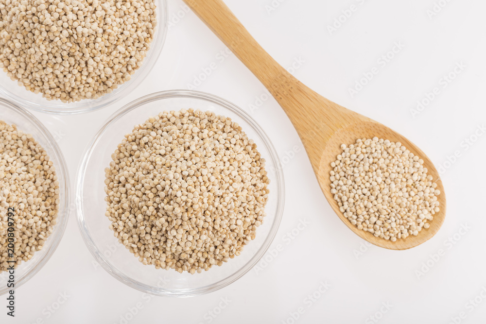Quinoa grains in bowl isolated on white background, Chenopodium quinoa Quinoa grains in bowl isolated on white background, Chenopodium quinoa