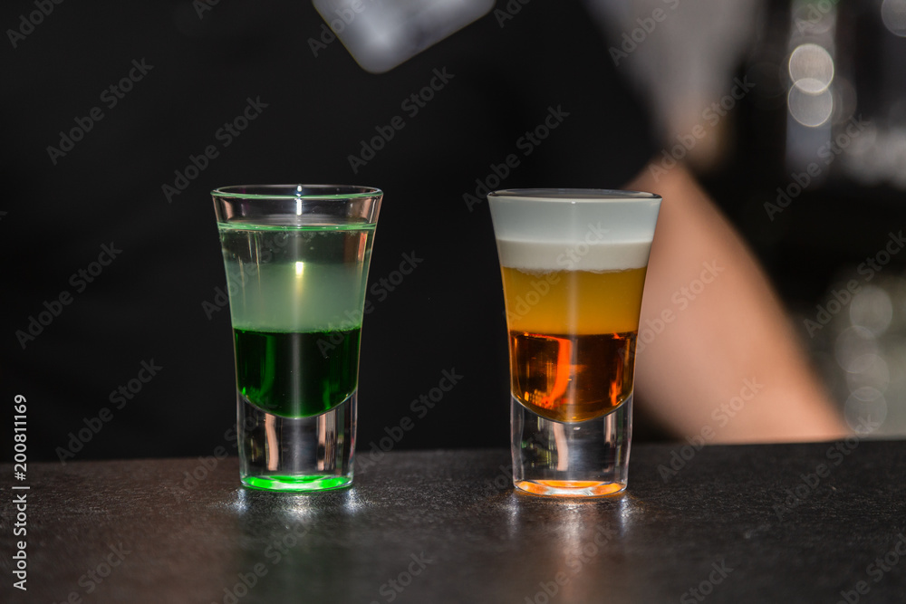 Colored cocktail on the bar in the nightclub Colored cocktail on the bar in the nightclub