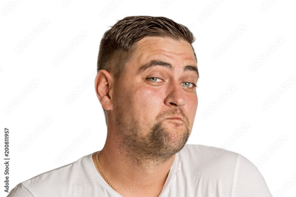 Cute young man with a surprised smile, isolated on a white background Cute young man with a surprised smile, isolated on a white background
