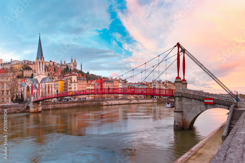 Saint Georges church and footbridge across Saone river, Old town with Fourviere cathedral at gorgeous sunset in Lyon, France