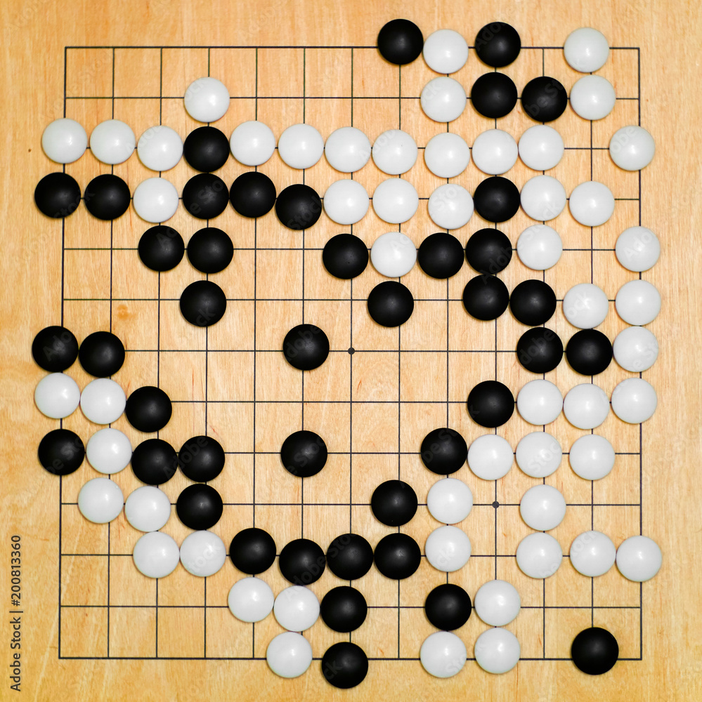 Go East game view from the top. Traditional Chinese game. wooden board Go East game view from the top. Traditional Chinese game. wooden board