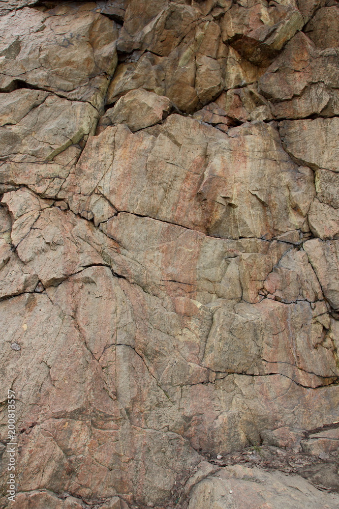 Granite rocks with faults, background of old stones, destruction of a granite wall, ecological problems of the planet Earth, climate change, natural pattern, art Granite rocks with faults, background of old stones, destruction of a granite wall, ecological problems of the planet Earth, climate change, natural pattern, art