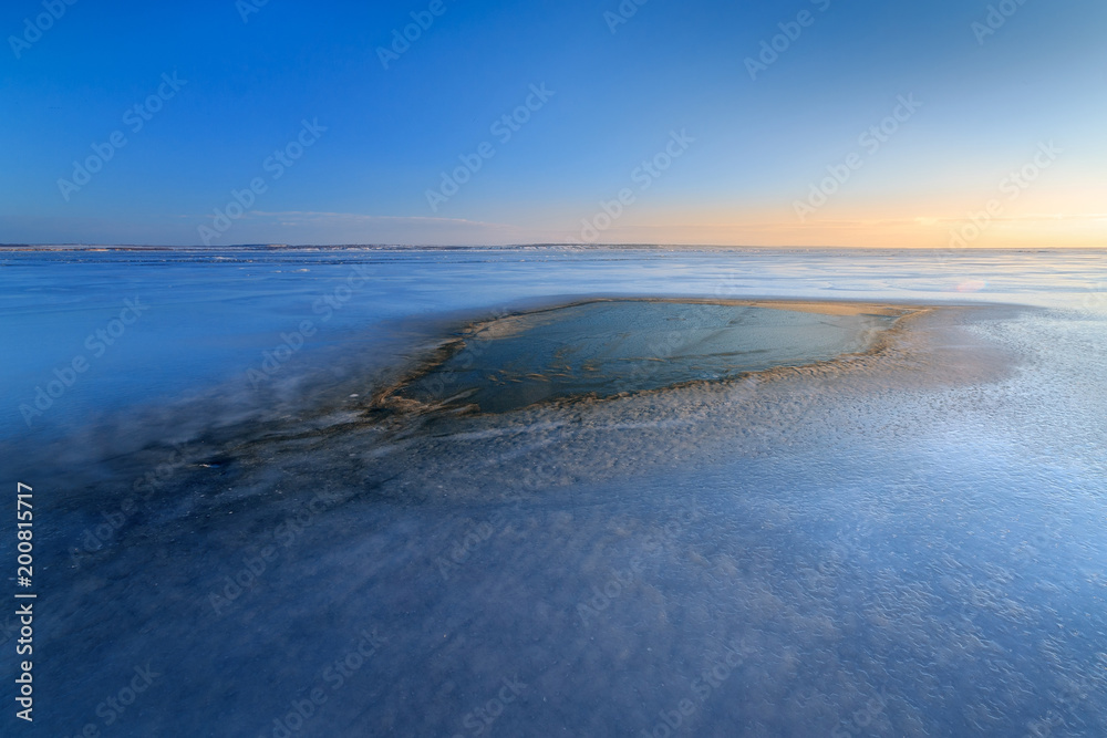 spot dawn on a frozen lake / icy landscape Ukraine winter spot dawn on a frozen lake / icy landscape Ukraine winter