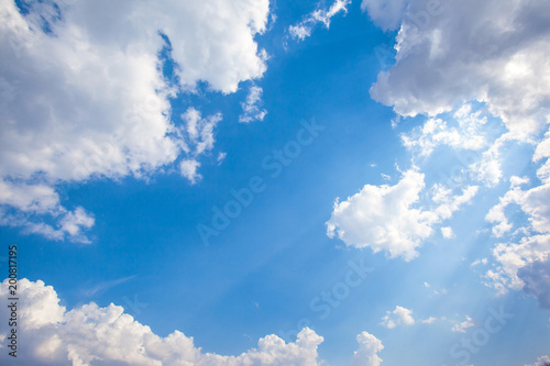 Big white cumulus cloud against blue sky