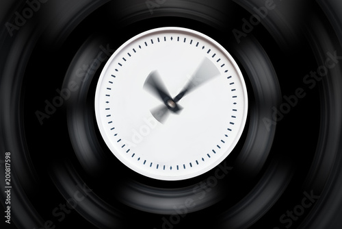 round white clock with blurred arrows on a dark isolated background