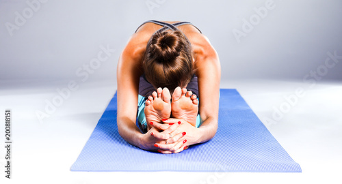 Portrait of sport girl doing yoga stretching exercise. yoga
