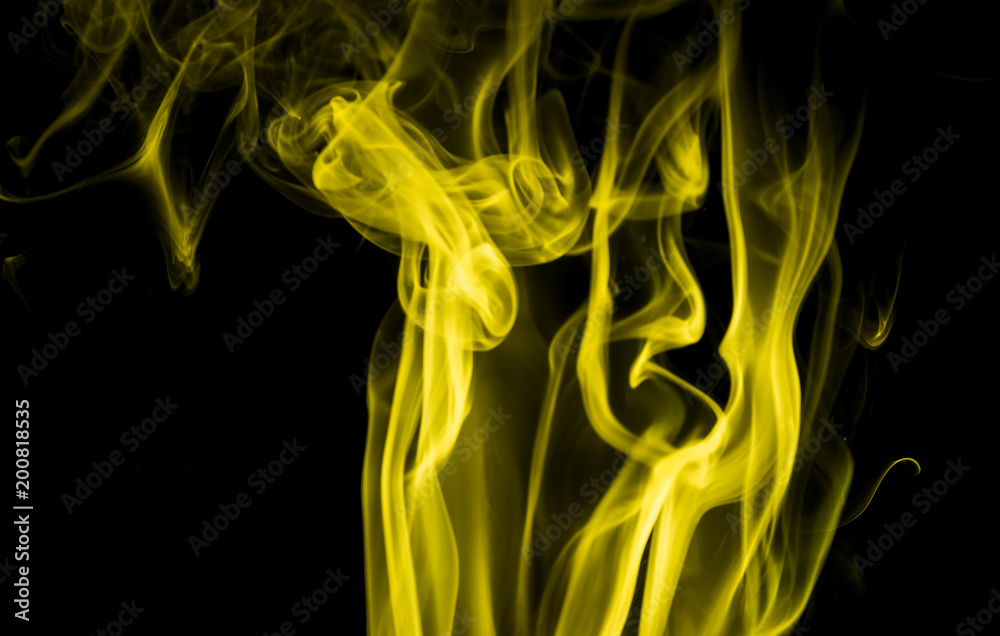 Fototapeta premium Yellow smoke on black background