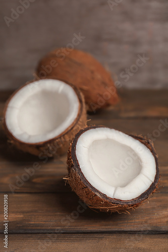 Fresh yummy coconuts on wooden table