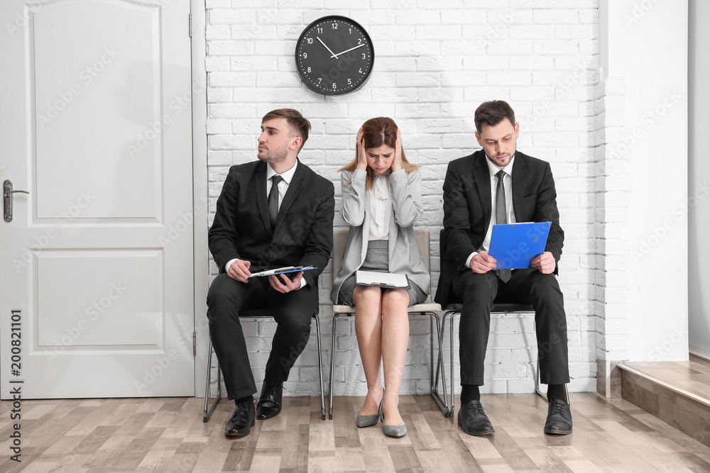 Group of people waiting for job interview, indoors Group of people waiting for job interview, indoors